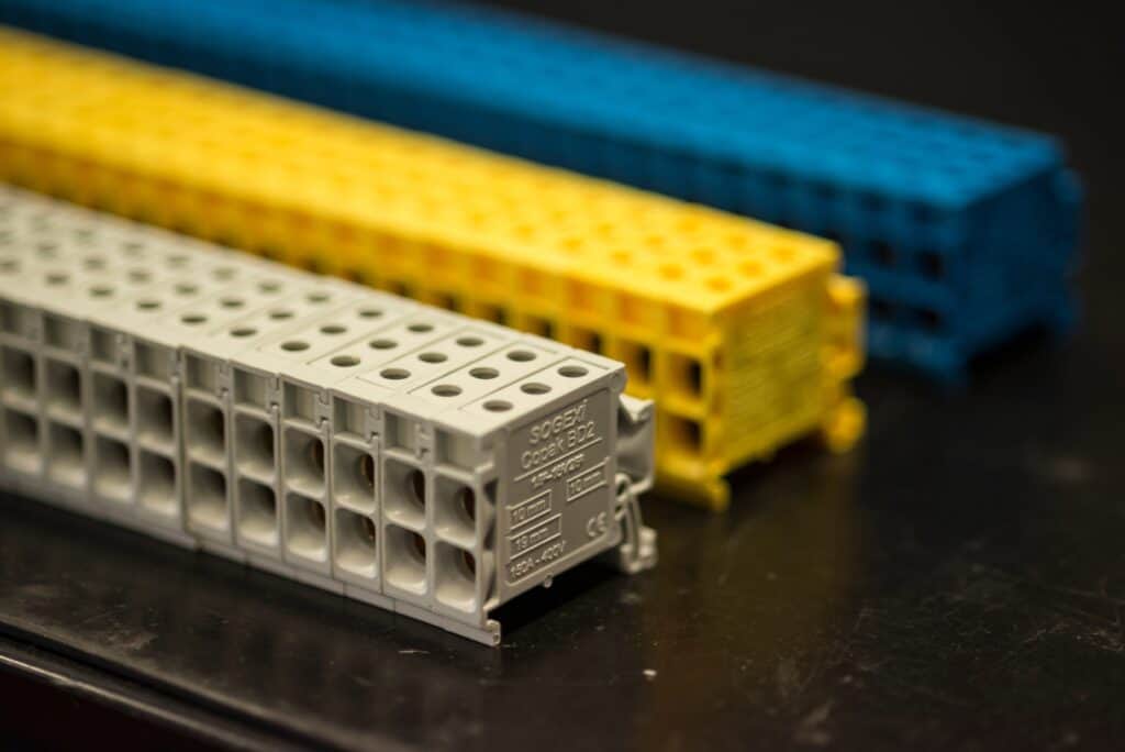 Electrical terminals and protection for enclosures